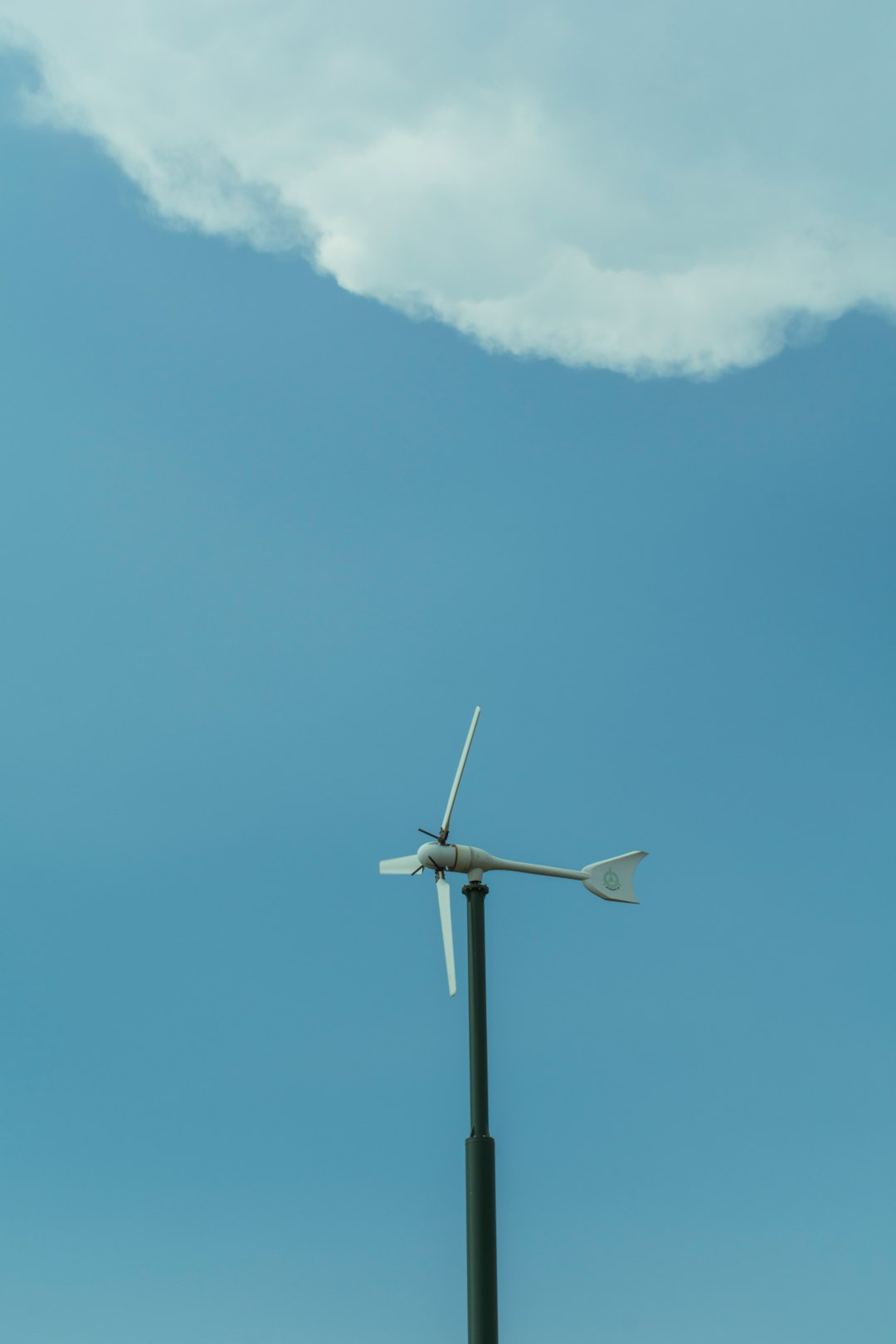 our-services-01 white-wind-turbine-under-blue-sky-xkmasix86di